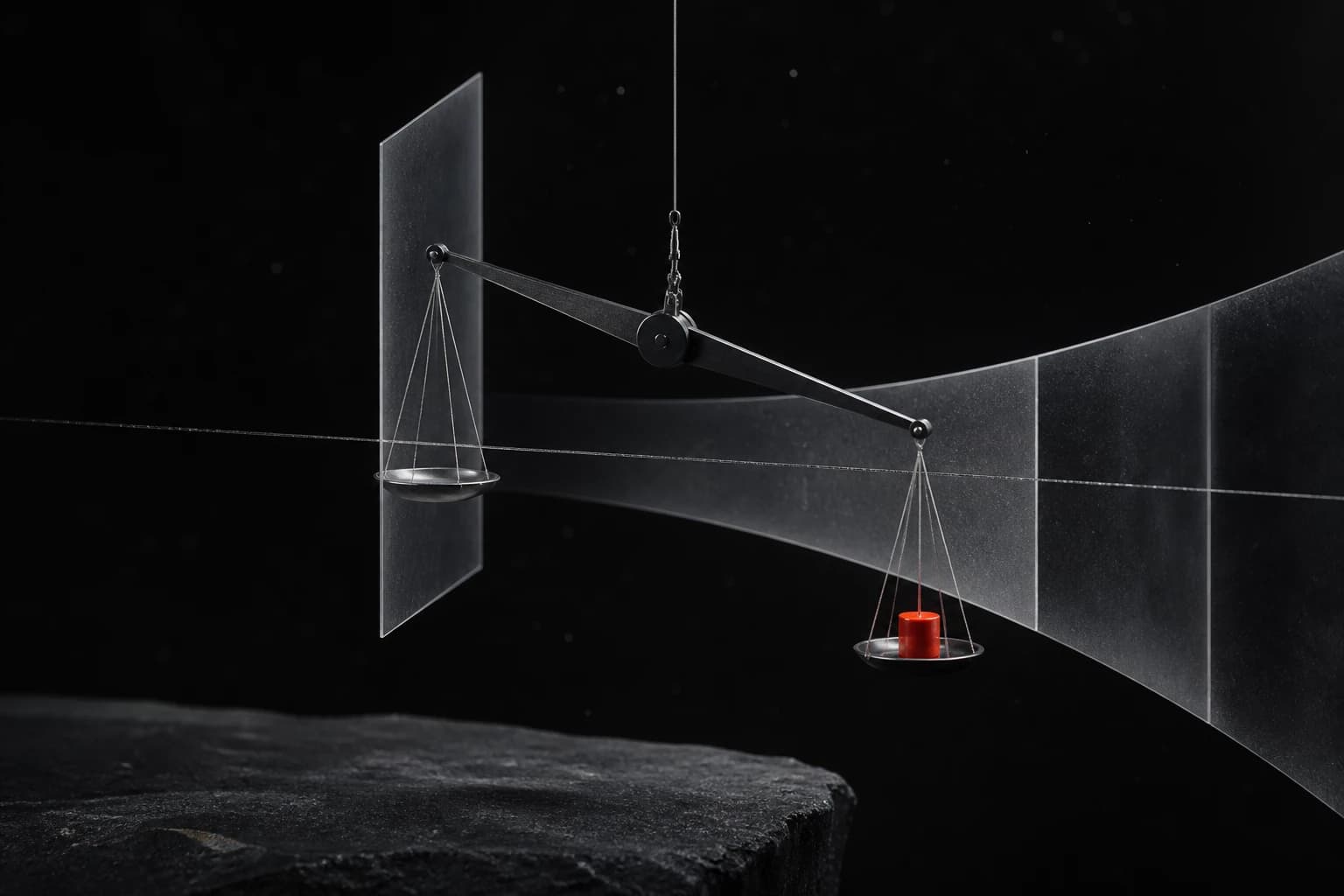 A suspended graphite balance tilts slightly toward a small red weight while translucent silver planes widen behind it in a black space