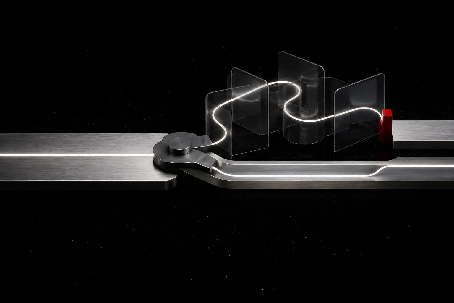 A brushed-silver track splits at a graphite mechanism into a short straight route and a longer glowing route through transparent planes, with a small red gate at the far end